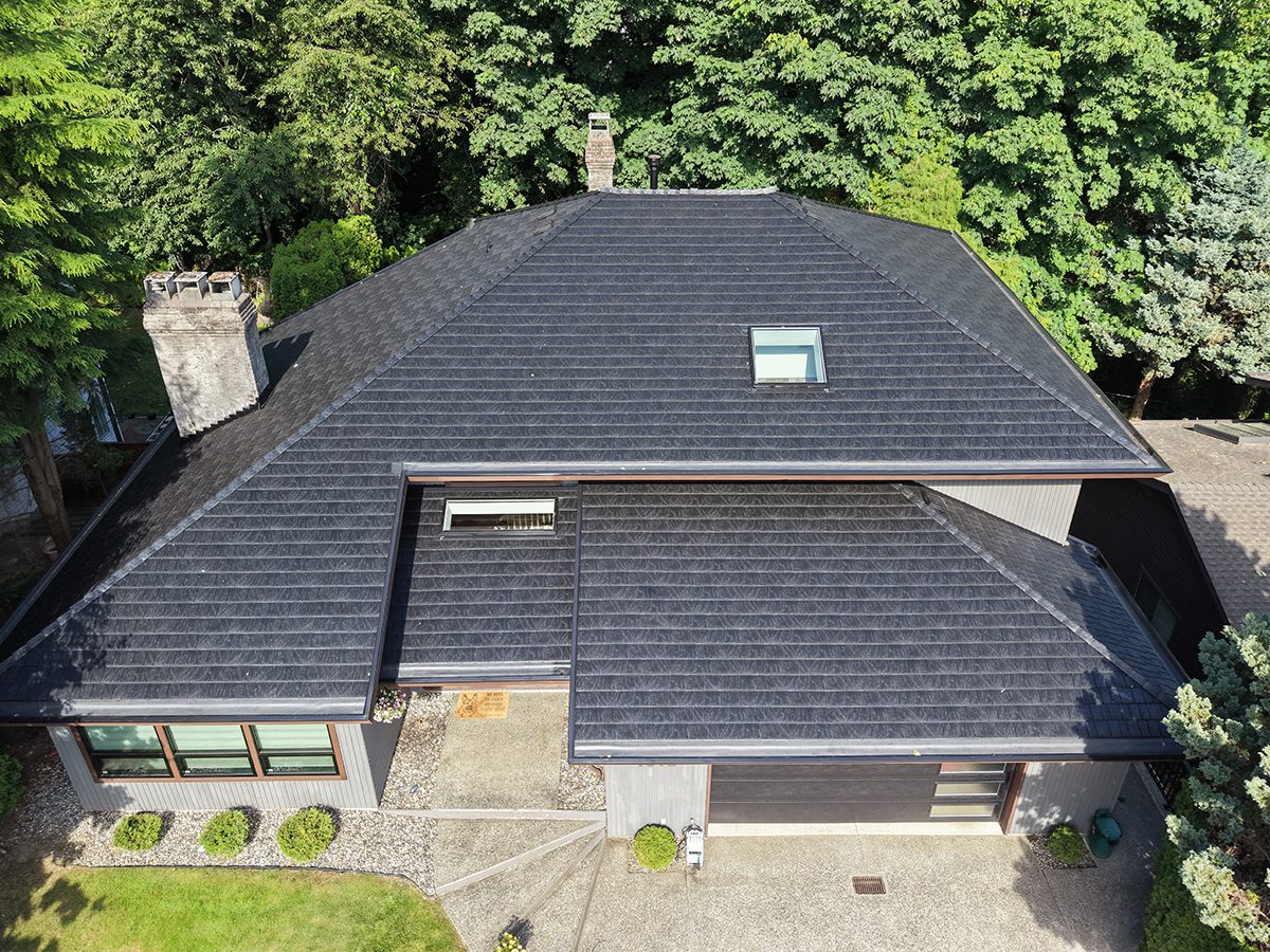 After: new dark architectural shingle roof replacing aging cedar shakes