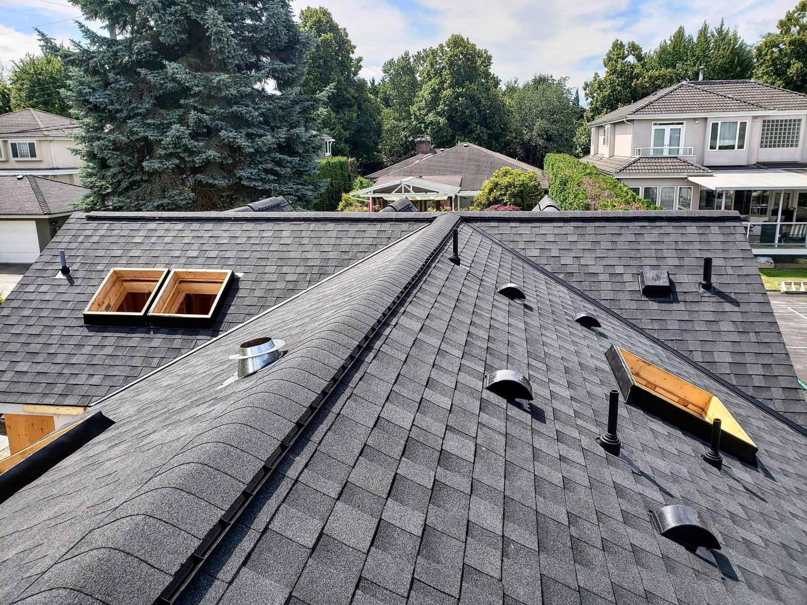 New skylight openings framed and installed during a roof replacement